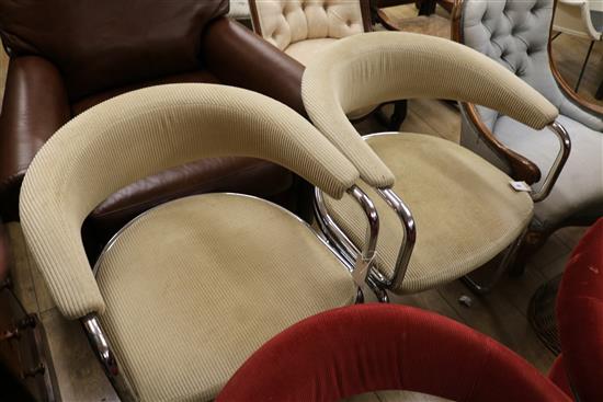 A pair of chrome and upholstered tub chairs
